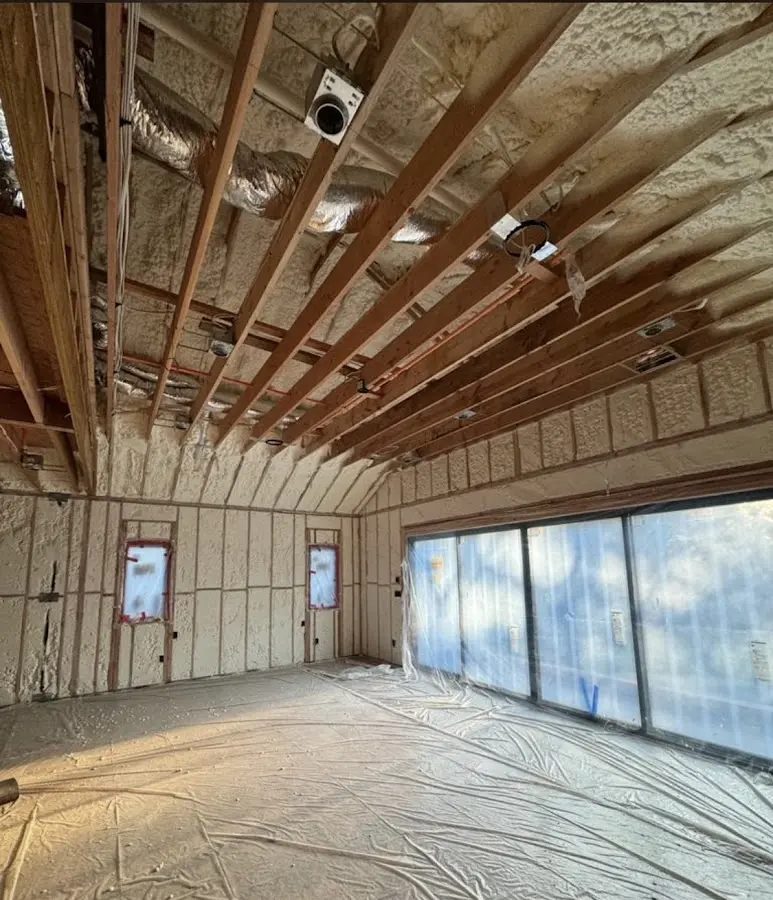 Interior walls and ceiling insulated with spray foam during new construction in Martha Lake